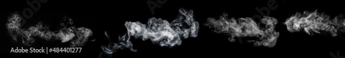 A set of four different types of swirling, wriggling smoke, vapor isolated on a black background for overlaying on your photos