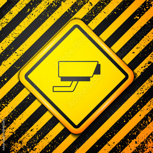 Black Security camera icon isolated on yellow background. Warning sign. Vector