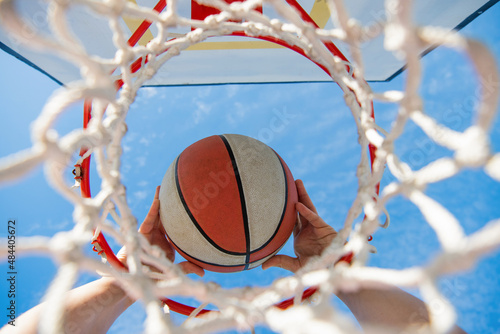 basketball player throws the ball into the hoop, sport photo