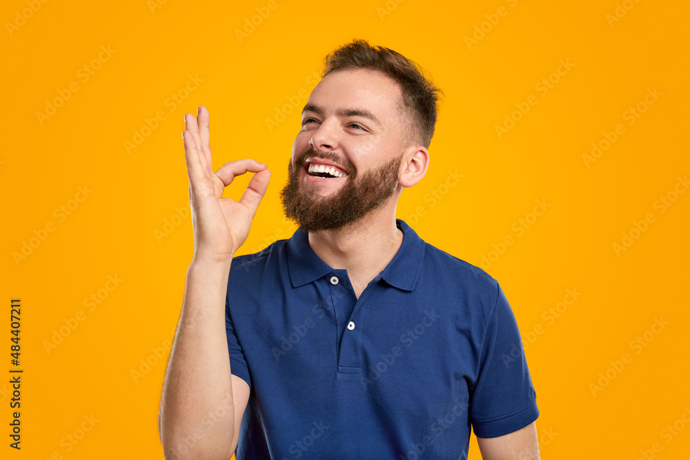 Happy man showing OK gesture in studio Happy man showing OK gesture in studio
