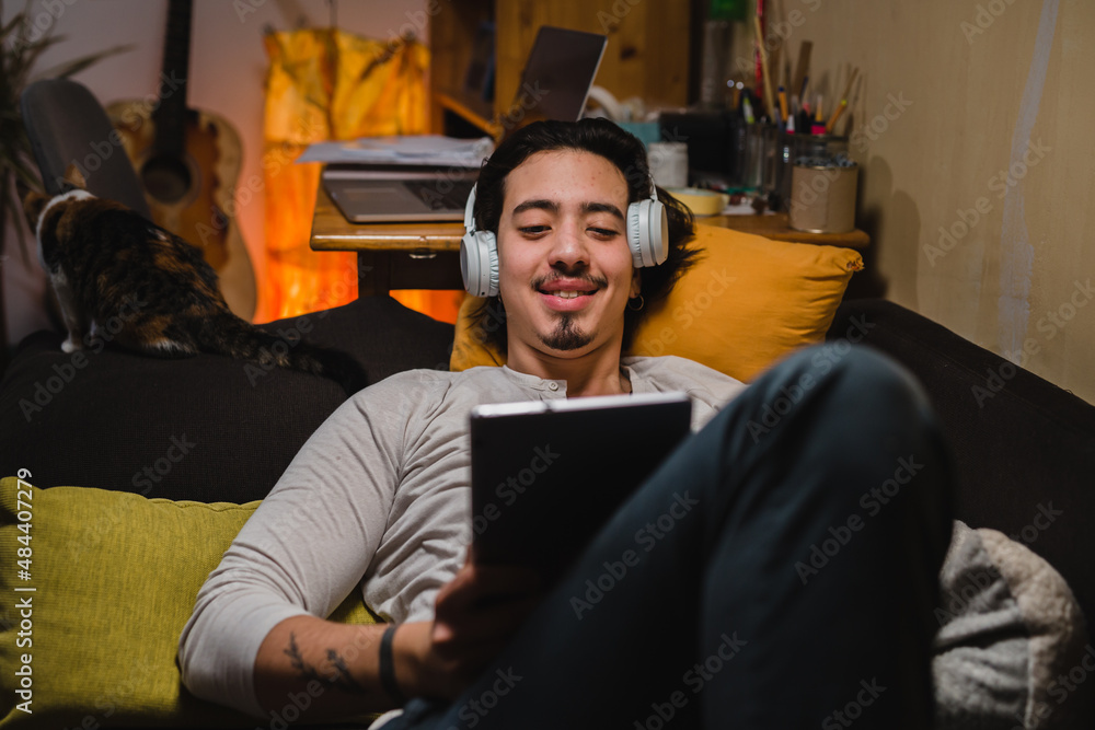 man using digital tablet at home