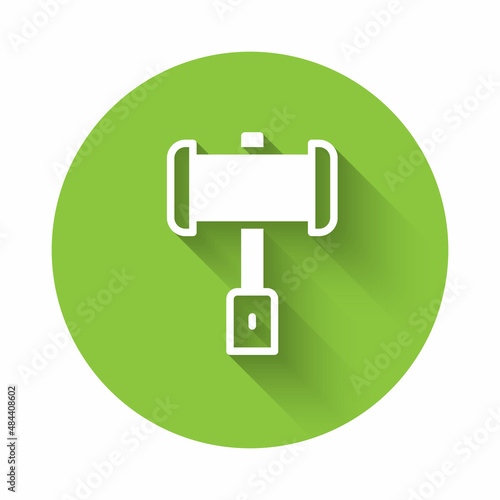 White Medieval battle hammer icon isolated with long shadow background. Green circle button. Vector