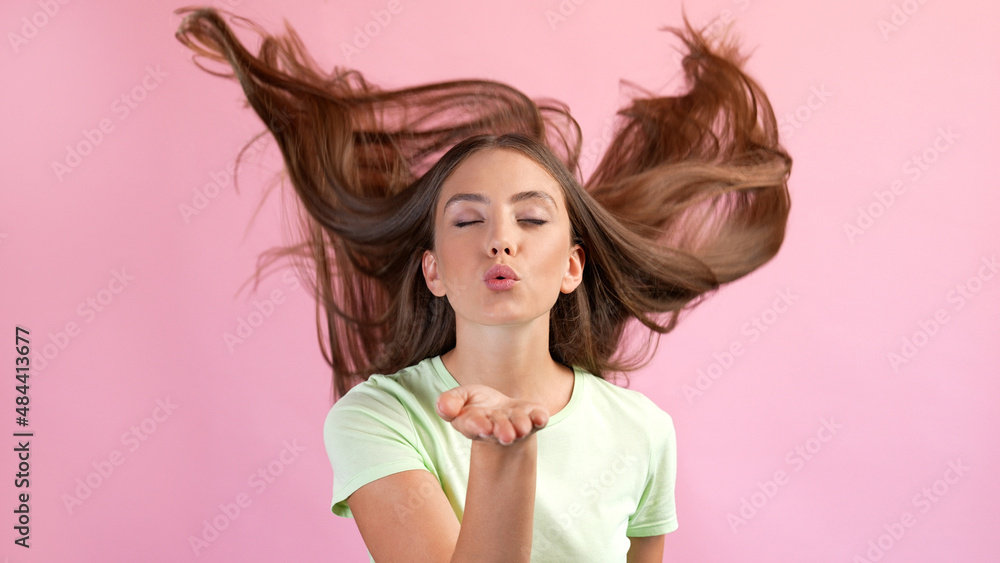 Photo of dreamy romantic lady haircut flying send air kiss flirt boyfriend isolated over pastel color background Photo of dreamy romantic lady haircut flying send air kiss flirt boyfriend isolated over pastel color background