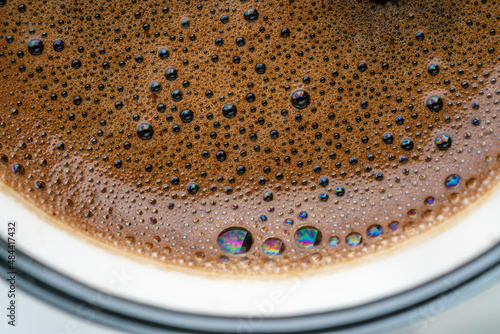close up of a cup of coffee. coffee foam as a background © berna_namoglu