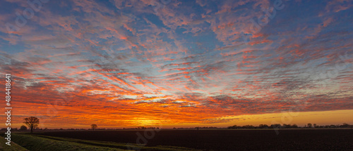 Vivid sunrise across the flat Fenlands of Lincolnshire  UK