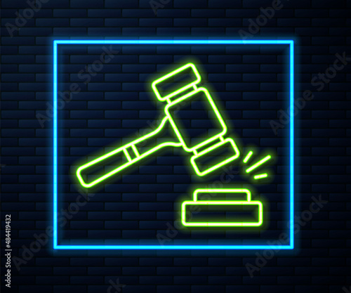 Glowing neon line Auction hammer icon isolated on brick wall background. Gavel - hammer of judge or auctioneer. Bidding process, deal done. Auction bidding. Vector