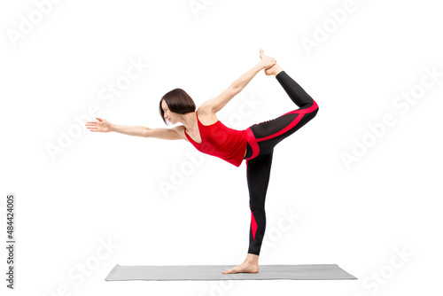 Yoga, Lord of the dance pose. Fit caucasian woman in red sportswear practice Natarajasana exercise, isolated on white.