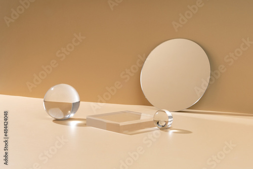 Skincare and cosmetic product showcase stand photography for online marketing include crystal ball mirror and crystal stand on beige background