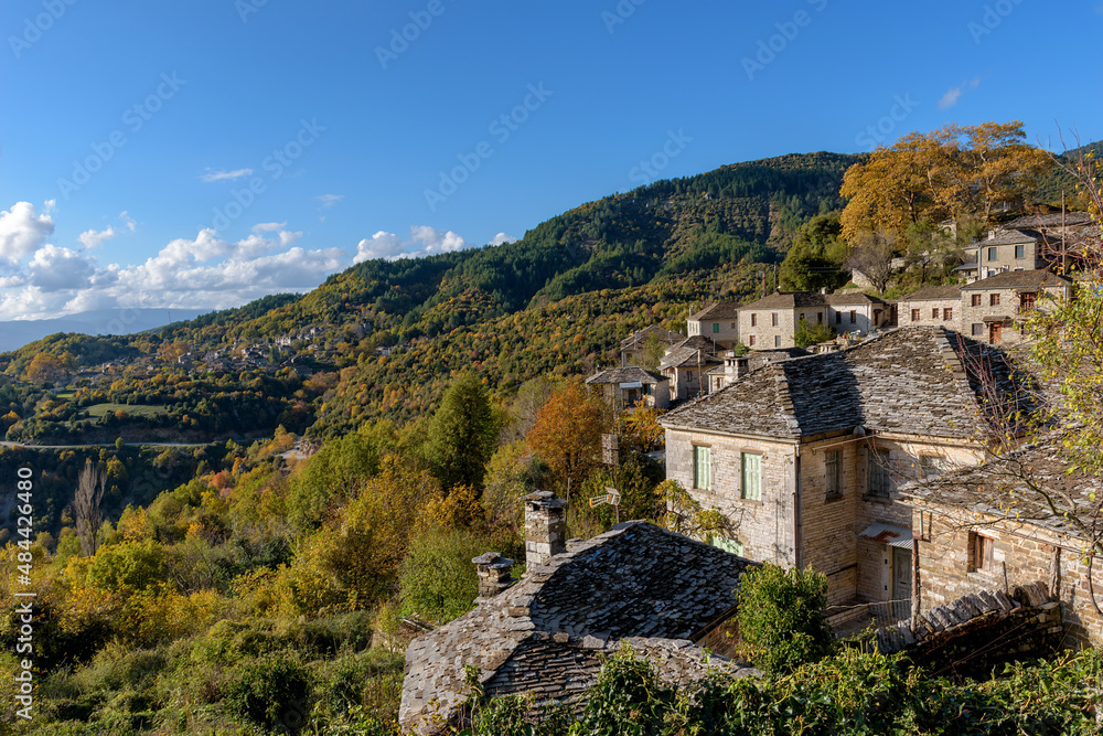 View of the traditional village Mikro Papigo with with the famous stone buildings during  fall season in  zagori Greece