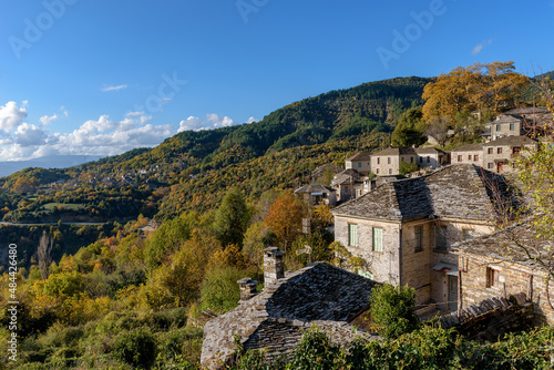 View of the traditional village Mikro Papigo with with the famous stone buildings during fall season in zagori Greece