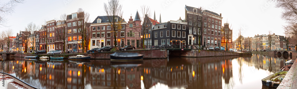 Panorama of the city embankment of Amsterdam at dawn.