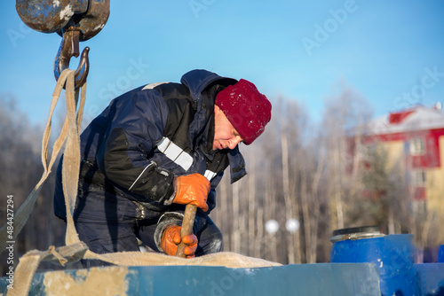 Portrait of installer at unloading ice blocks