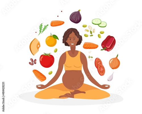 Healthy nutrition during pregnancy. Healthy food. Pregnant African American woman with sportswear does lotus position. Food for pregnant woman. Healthy food during pregnancy concept