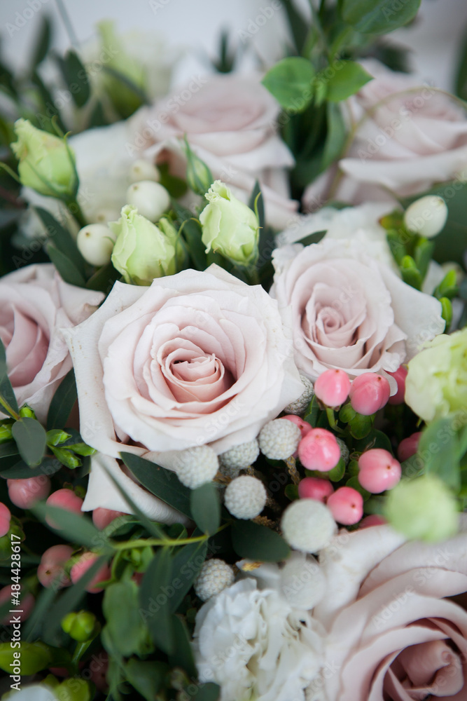 bridal bouquet in boho, rustic style. bouquet of soft pink roses, eustomas and eucalyptus branches bridal bouquet in boho, rustic style. bouquet of soft pink roses, eustomas and eucalyptus branches