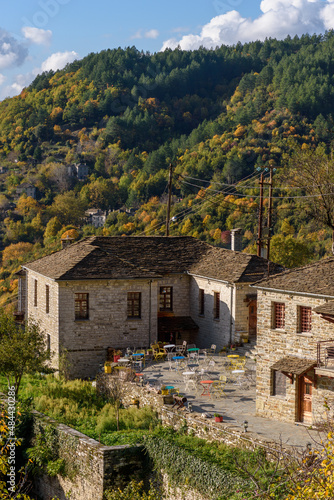 View of the traditional village Mikro Papigo with with the famous stone buildings during  fall season in  zagori Greece