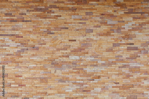 Texture of golden sandstone bricks