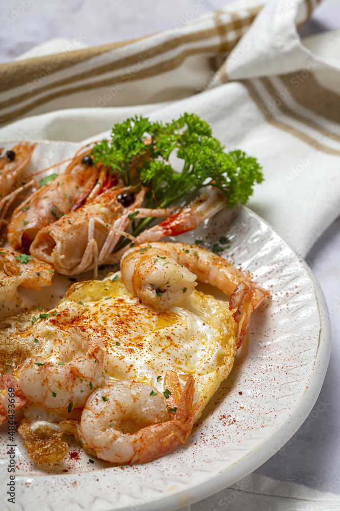 Fried eggs with prawns on towel Fried eggs with prawns on towel