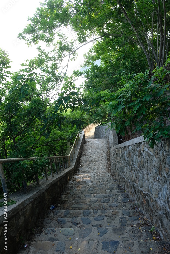 View of stairs to the Cristo Rei statue located on the top of the hill at the end of the Fatucama peninsula, Dili, Timor Leste. View of stairs to the Cristo Rei statue located on the top of the hill at the end of the Fatucama peninsula, Dili, Timor Leste.