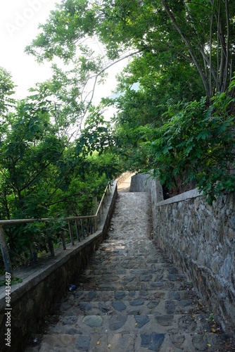 View of stairs to the Cristo Rei statue located on the top of the hill at the end of the Fatucama peninsula, Dili, Timor Leste. photo