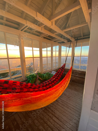 Hammocks hanging inside Mount Pilchuck fire lookout at sunset photo