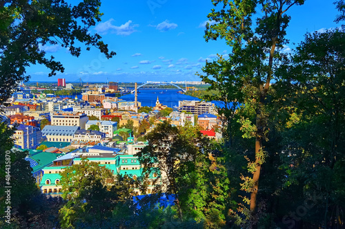 Aerial top view of Kyiv cityscape, Dnieper river and Podol historical district skyline from above, Kontraktova square with ferris wheel, city of Kiev, Ukraine. photo