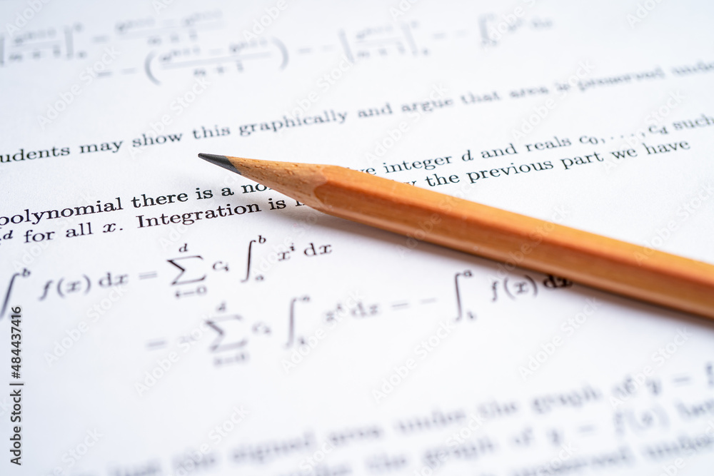 Pencil on mathematic formula exercise test paper in education school. Pencil on mathematic formula exercise test paper in education school.