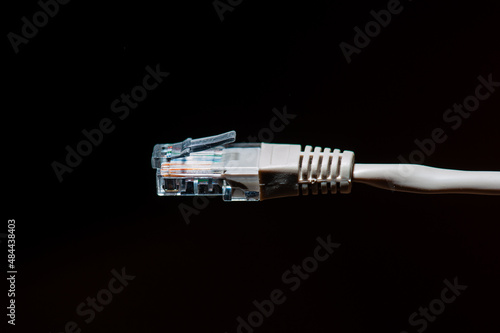 Wired internet cable connection on black background