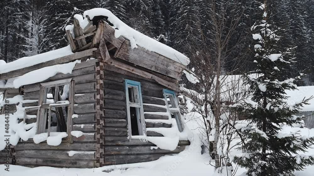 Abandoned houses in the mountains, the village of Burkut. Ruins of an old settlement in winter. Houses and buildings destroyed after flood. Ruined and damaged villages. Abandoned buildings.