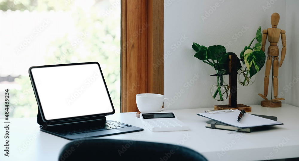 Digital tablet with white blank screen on table. workspace in modern office concept.. Digital tablet with white blank screen on table. workspace in modern office concept..