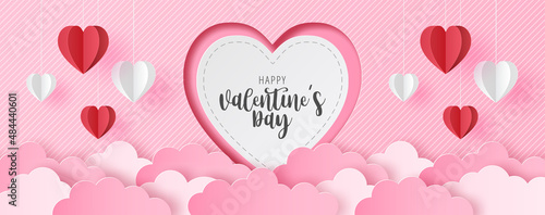 Paper cut of Happy Valentine's Day text on white heart with origami paper heart shape on pastel color background for greeting card, banner, poster, headers website