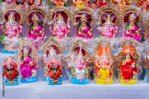 Colourful clay idols of Goddess Laxmi and God Ganesha. Displayed for sale at Kalighat, West Bengal, India