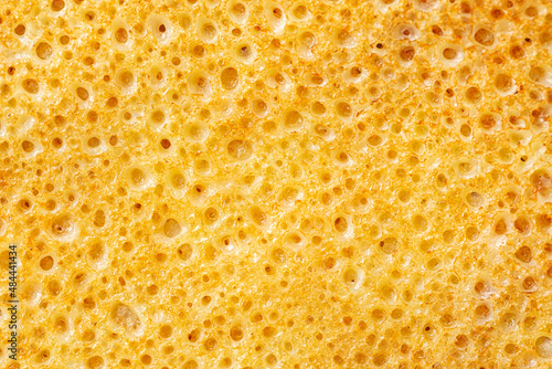 Pancake or crepe surface. Macro photo background. Bubbled Texture.