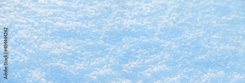 Abstract natural winter snow background. blue-white beautiful snowflakes surface macro shot. winter season. Texture for design. banner. copy space. soft selective focus