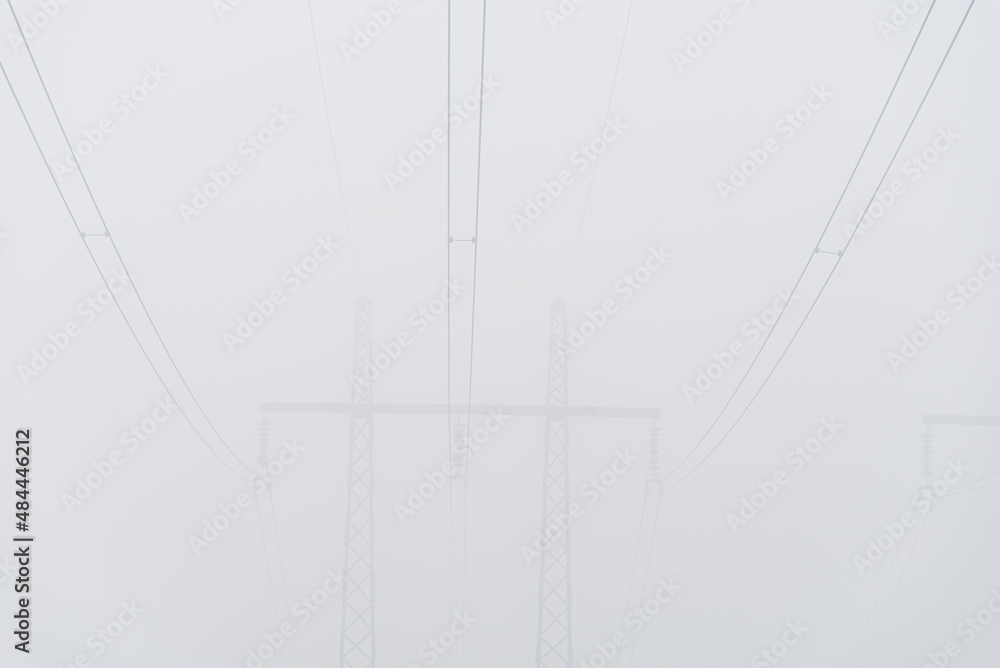 Power lines in mist, Sweden Power lines in mist, Sweden