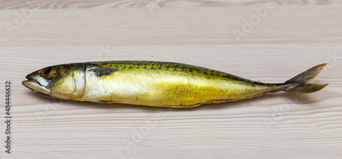 mackerel fish on a white wooden table.