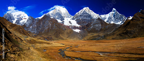 Panorama of snowy mountains and valley of rivers in the remote Cordillera Huayhuash Circuit near Caraz in Peru. photo