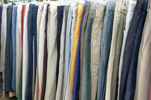 Wallpaper Mural Second hand clothes and pants with quality brands imported from abroad are sold on the roadside at low prices. The clothes and pants are still in good condition and still fit to wear. Torontodigital.ca