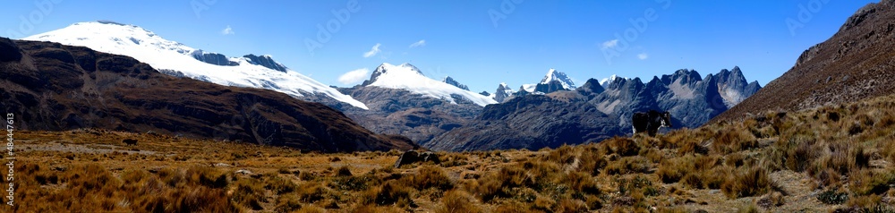 Panorama of snowy mountains and valley in the remote Cordillera Huayhuash Circuit near Caraz in Peru.