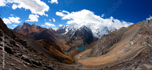 Photography Panorama of snowy mountains and valley in the remote Cordillera Huayhuash Circuit near Caraz in Peru