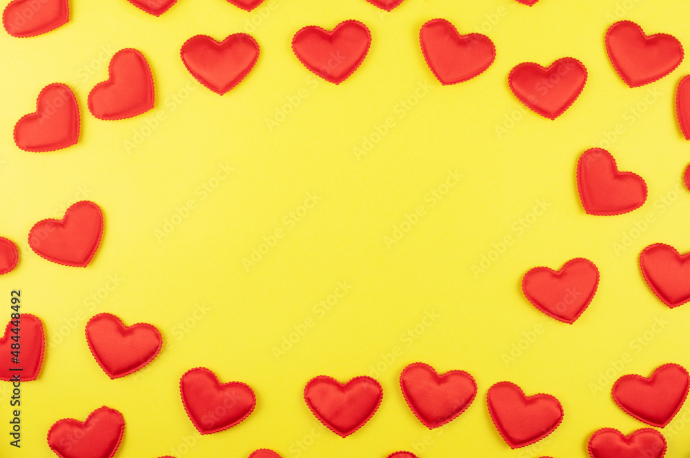 Valentine day yellow paper background with red hearts background. Valentines day or love concept, copy space Valentine day yellow paper background with red hearts background. Valentines day or love concept, copy space