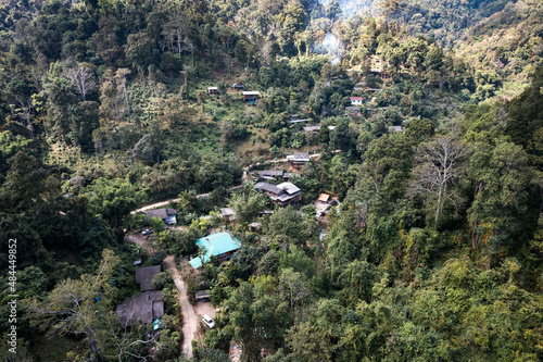 Aerial view of traditional rural village of tribe local people in tropical rainforest on countryside at national park