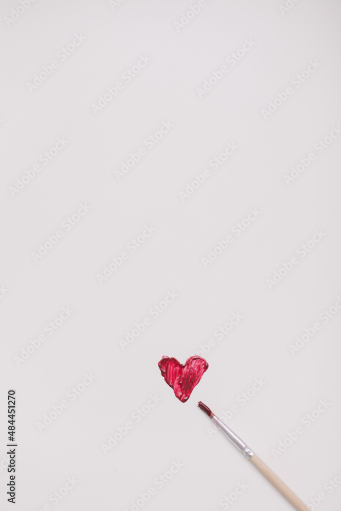 Heart symbol made of red brush strokes on white background. Valentine's Day, Woman Day composition. Heart symbol made of red brush strokes on white background. Valentine's Day, Woman Day composition.