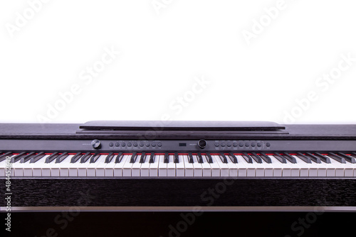 An electric piano on a white background, showing the modern piano keys on a white wall photo