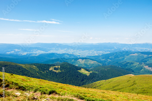 Fototapeta Naklejka Na Ścianę i Meble -  beautiful, summer slopes of mountains covered with green young grass against the blue sky, travel. High quality photo