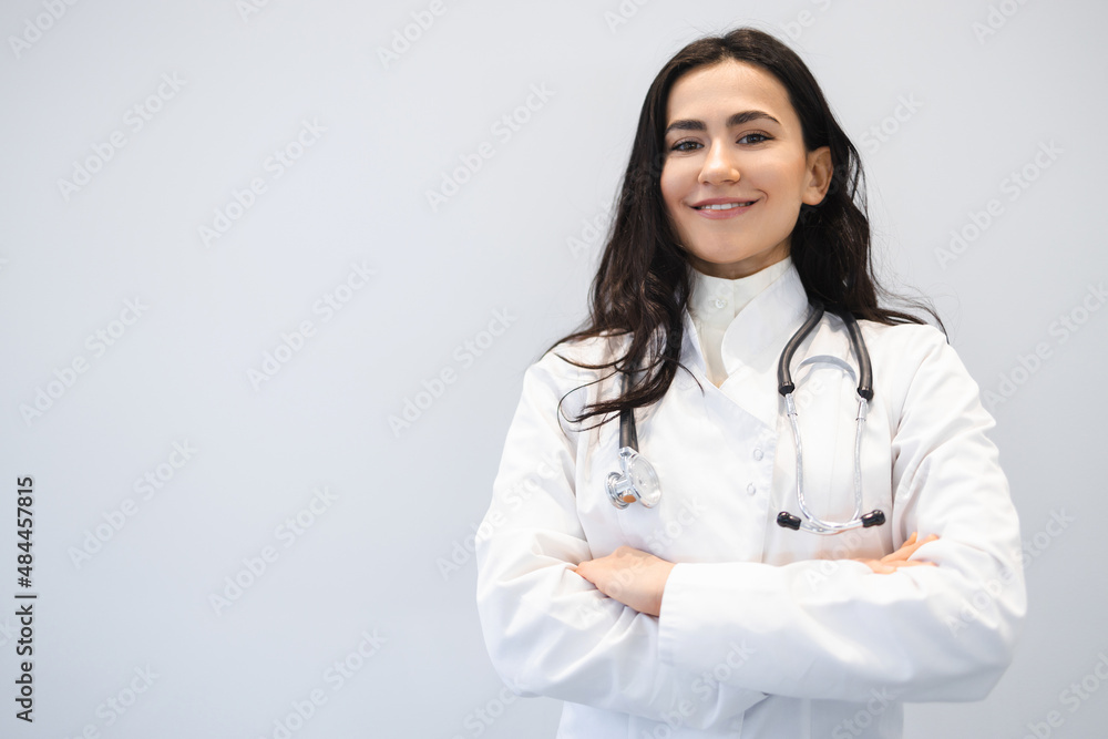 Portrait of a happy female doctor with arms crossed Portrait of a happy female doctor with arms crossed
