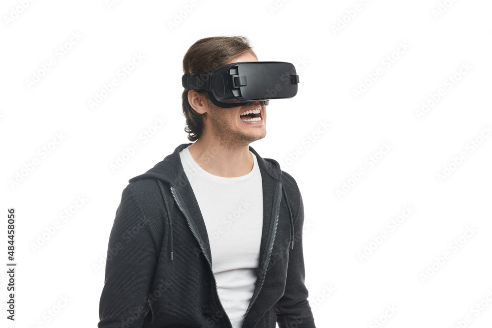 Excited man in VR headset exploring cyberspace Excited man in VR headset exploring cyberspace