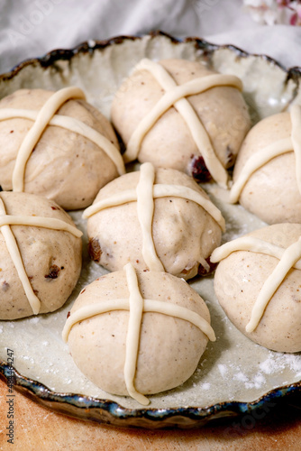 Raw unbaked homemade Easter traditional hot cross buns