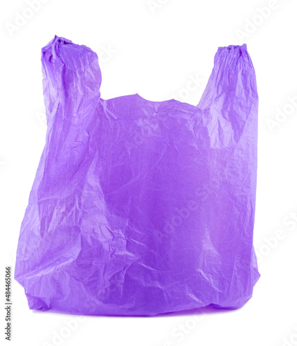 Purple plastic bag empty. Plastic bags are the cause of major environmental concerns. Object is isolated on white background without shadows.