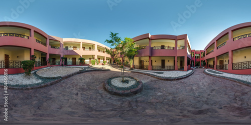 full seamless spherical hdr 360 panorama view inside the courtyard of an two-story building with many doors in equirectangular projection, ready for VR AR virtual reality