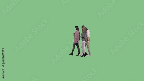 Three young and elegant women walk together and talk. Chromakey background. Alpha channel